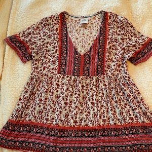 Beautiful flowy blouse/top. Cream/beige color with pink floral pattern.